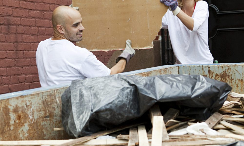 Couple taking a break during a DIY home renovation project
