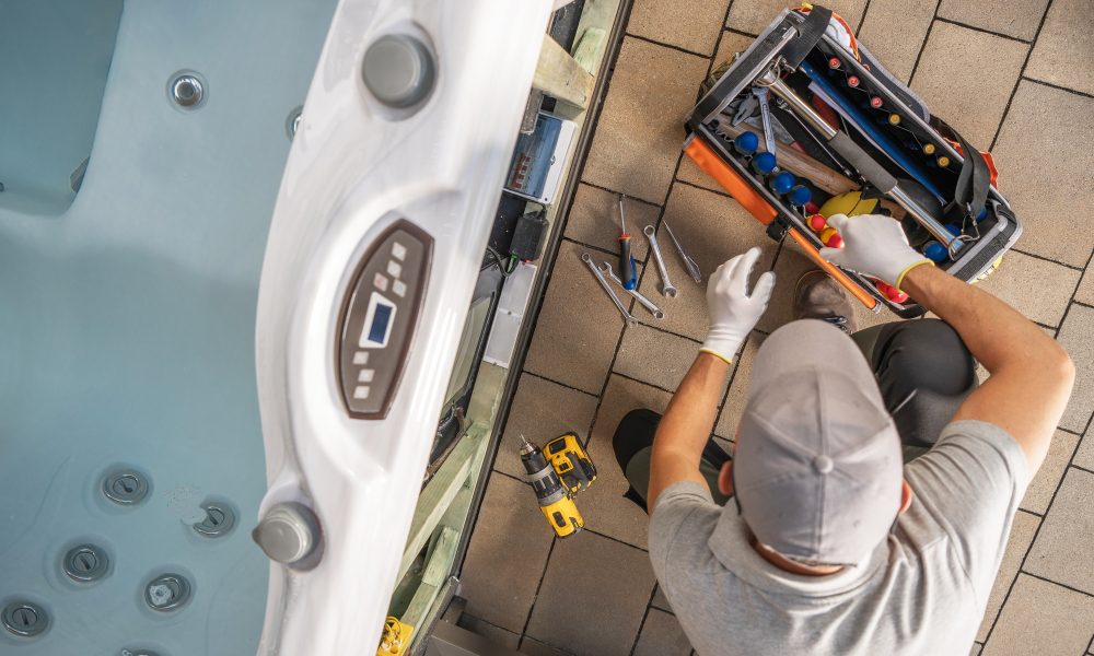 Hot Tub Removal in Tampa, FL. Hot Tub Technician Repairing Jets