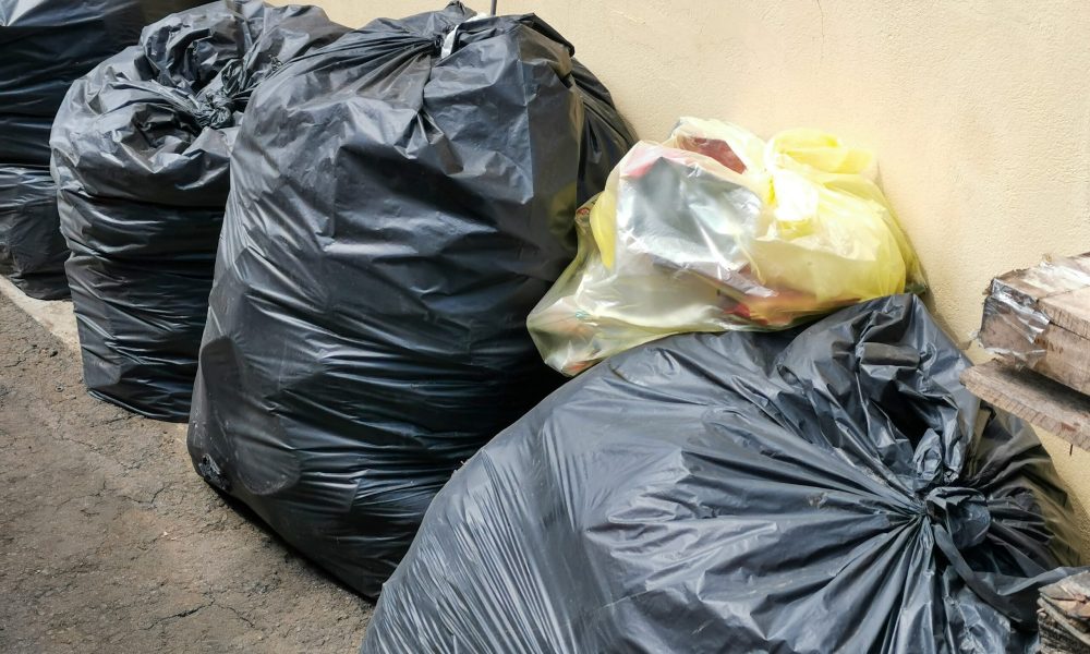 huge-amounts-black-garbage-bags-on-the-factory-flo-2025-01-07-06-09-00-utc